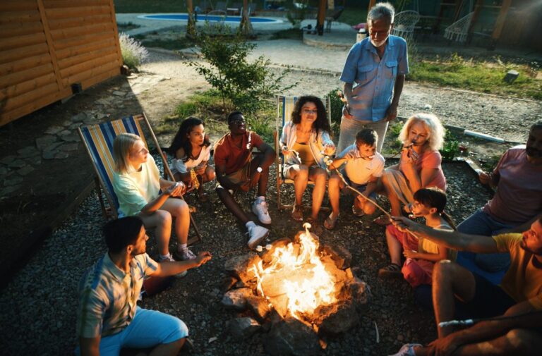 Family enjoying a mosquito-free backyard by the campfire, protected by Pro Mosquito Solutions pest control services.